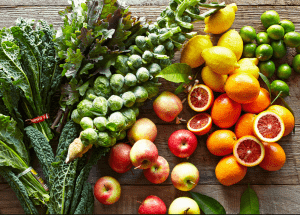 a group of fruits and vegetables on a wood surface Healthy Weight Loss Diets Wigan
