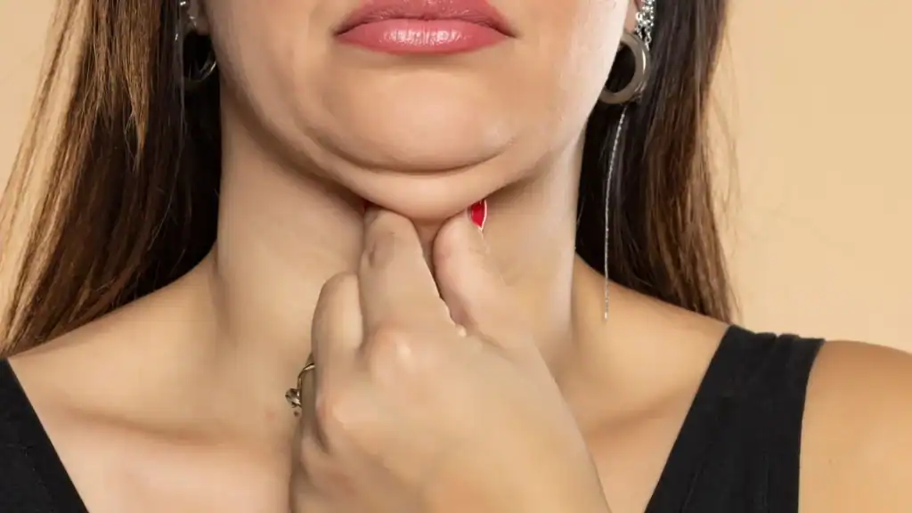 An image of a woman with double chin, sad, worried : Non Surgical Double Chin Removal Treatment in Wigan, UK